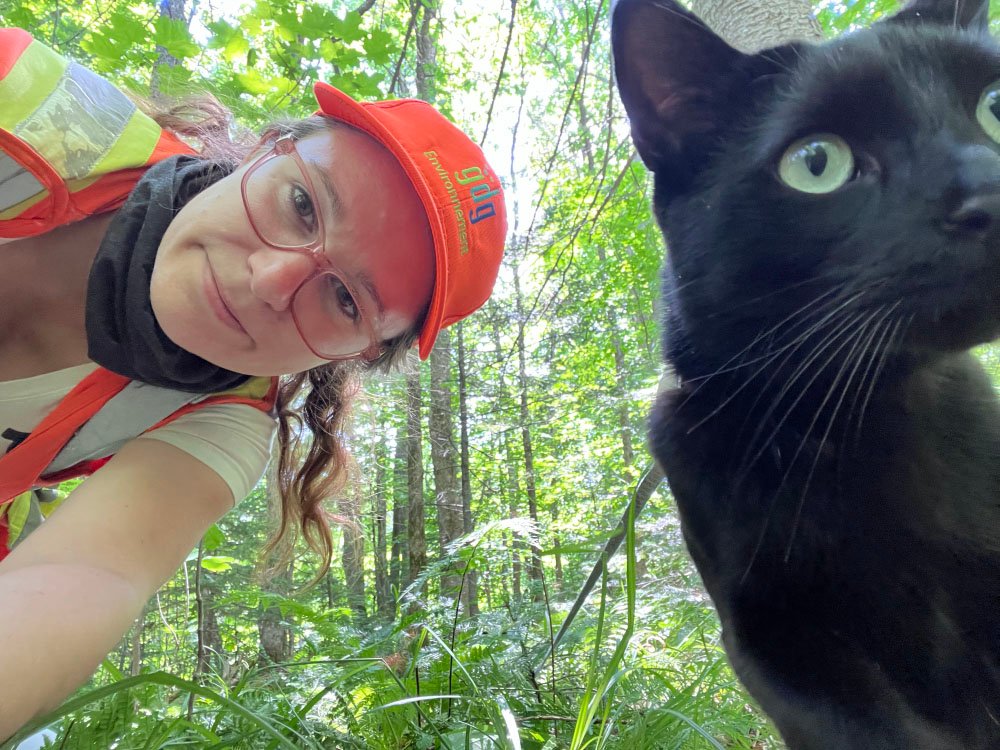 Woman working with her cat